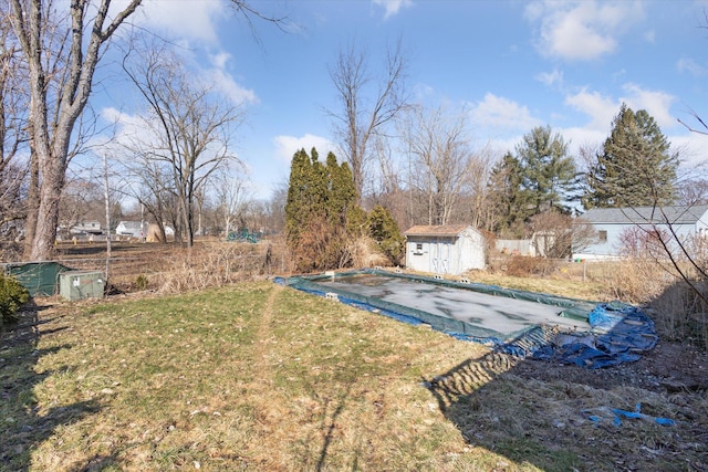 view of yard with an outbuilding and a shed