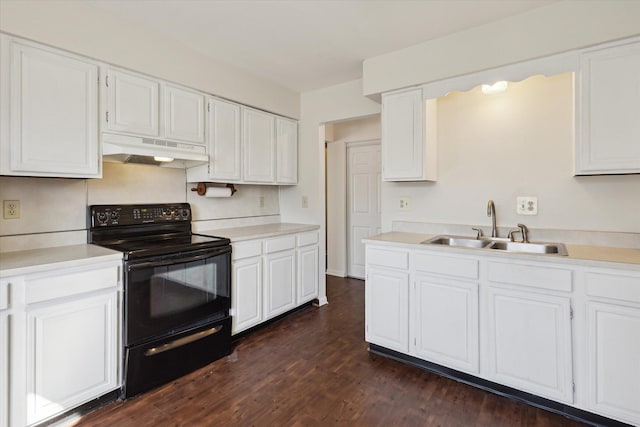 kitchen with electric range, under cabinet range hood, a sink, dark wood finished floors, and white cabinets