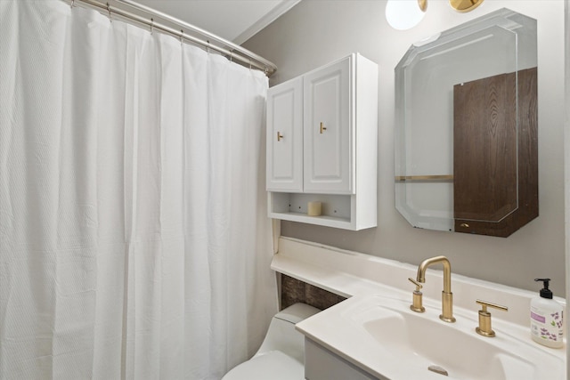 bathroom featuring toilet and vanity