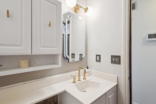 bathroom with visible vents and vanity