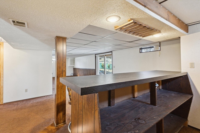 dining space featuring visible vents, a textured ceiling, and carpet flooring