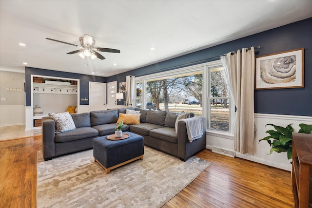 living room with ceiling fan, visible vents, wood finished floors, and recessed lighting