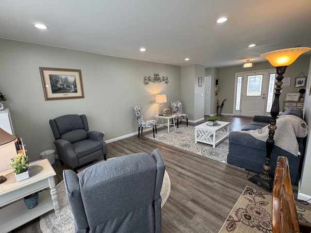 living area with recessed lighting, wood finished floors, and baseboards