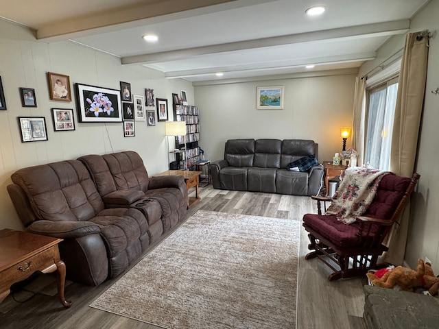 living room with beam ceiling, recessed lighting, and wood finished floors