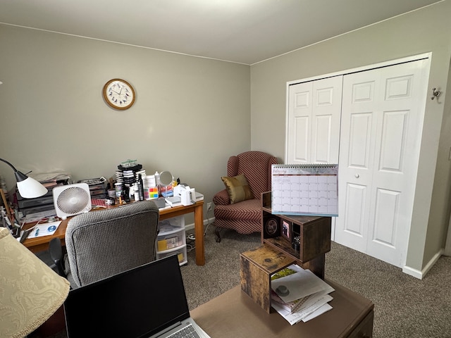 carpeted office space featuring baseboards