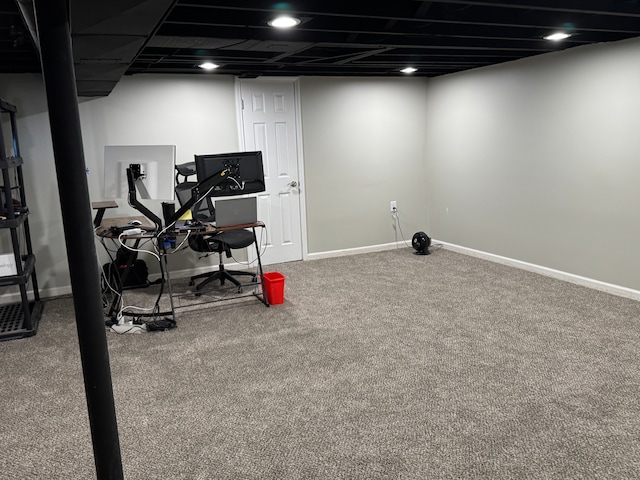 exercise area with baseboards and carpet flooring