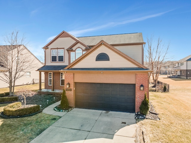 traditional-style house with a front yard, brick siding, an attached garage, and driveway