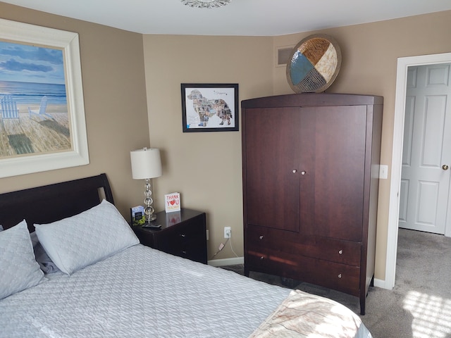 carpeted bedroom featuring baseboards