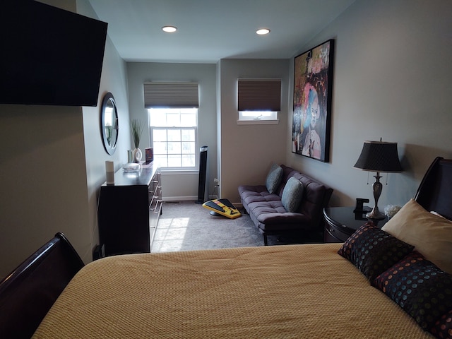 bedroom with recessed lighting, light colored carpet, and baseboards