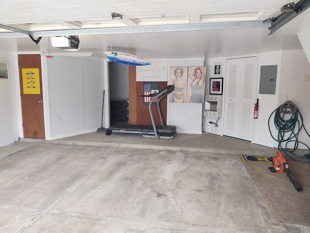 garage featuring electric panel and a garage door opener