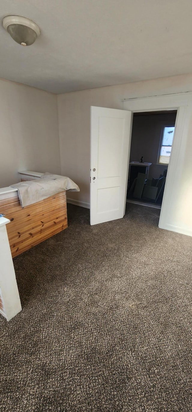 unfurnished bedroom with baseboards