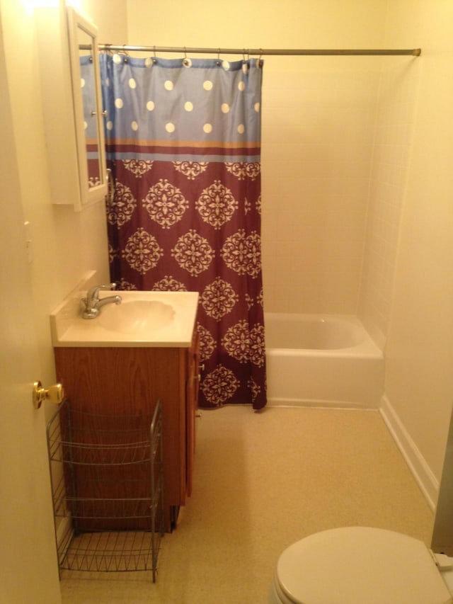 full bath featuring vanity, shower / bath combination with curtain, and toilet