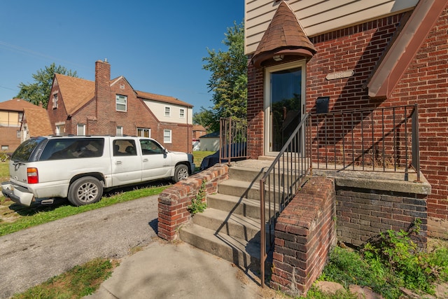 exterior space featuring brick siding