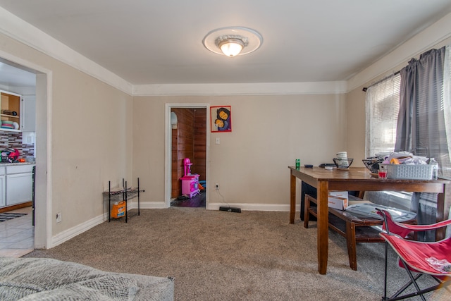 carpeted office space featuring baseboards