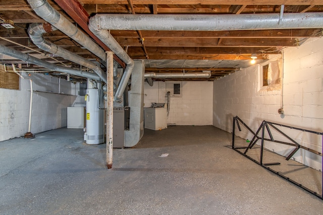 unfinished basement featuring washer / dryer and water heater