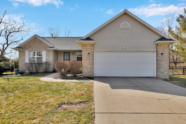 ranch-style home with driveway, roof with shingles, a front yard, an attached garage, and brick siding