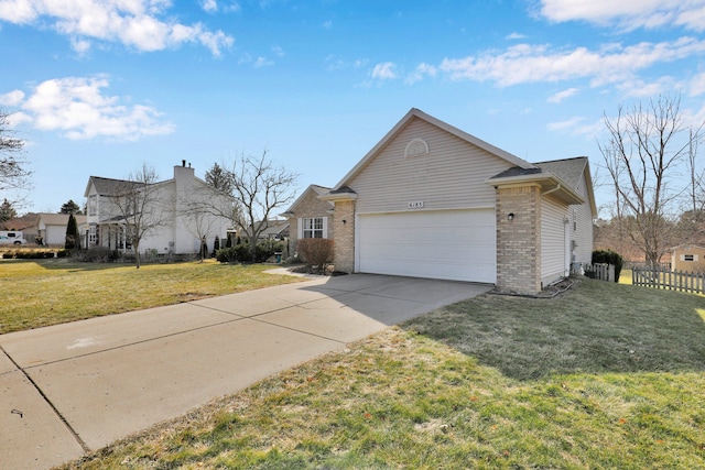 view of side of home featuring brick siding, fence, concrete driveway, a lawn, and a garage