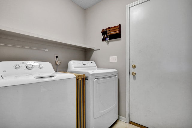 laundry area featuring separate washer and dryer and laundry area