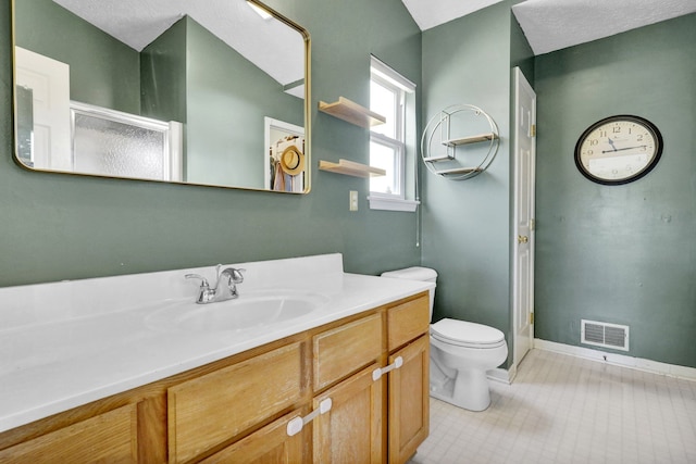 full bathroom featuring visible vents, baseboards, toilet, a shower with shower door, and vanity