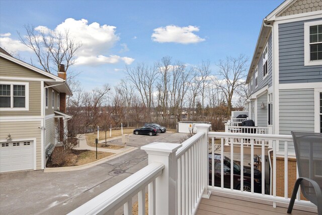 wooden terrace featuring a garage