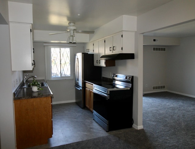 kitchen with visible vents, a sink, under cabinet range hood, white cabinetry, and stainless steel appliances