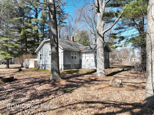 view of home's exterior featuring a chimney