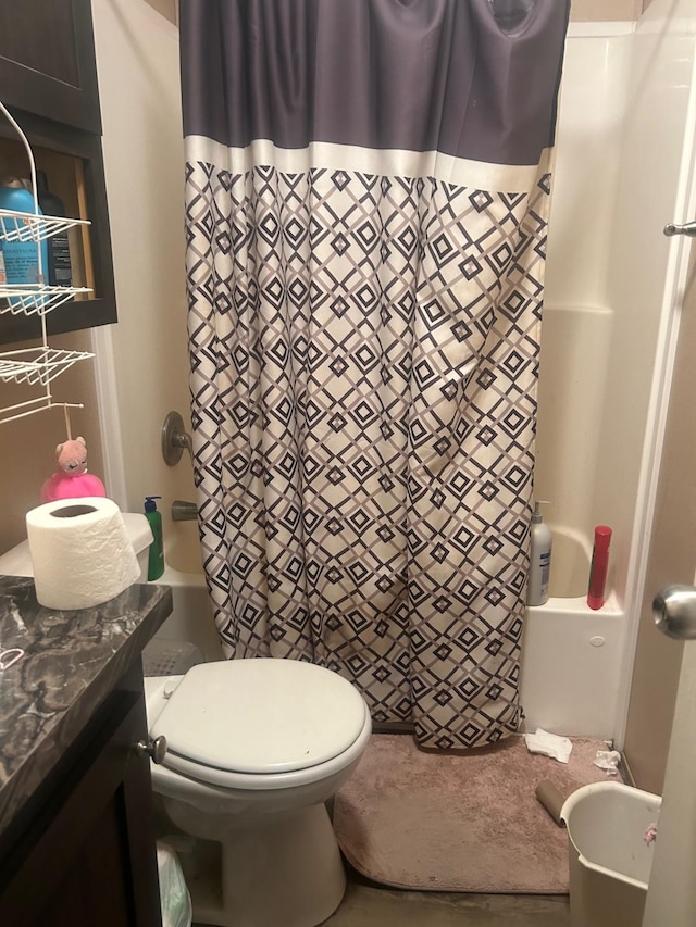 full bathroom featuring vanity, toilet, and shower / tub combo with curtain