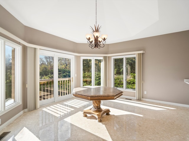 sunroom / solarium with a notable chandelier and visible vents