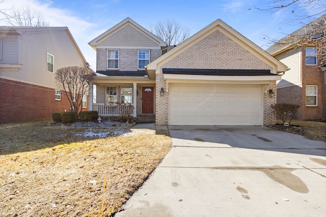 view of front of house with a porch, brick siding, a garage, and driveway