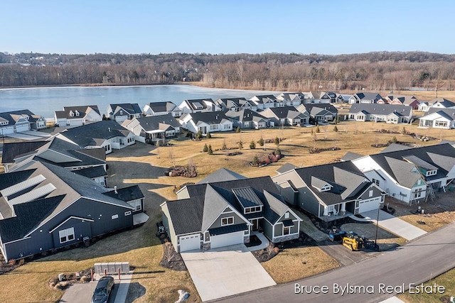 birds eye view of property featuring a residential view and a water view