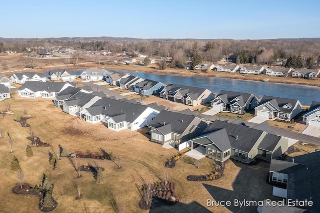 birds eye view of property featuring a residential view and a water view