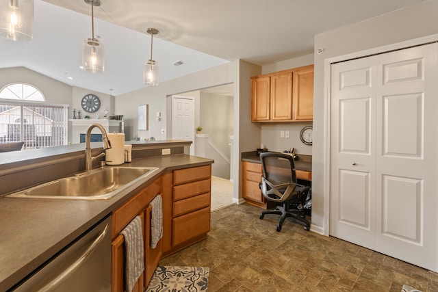 kitchen with dark countertops, dishwasher, pendant lighting, and a sink