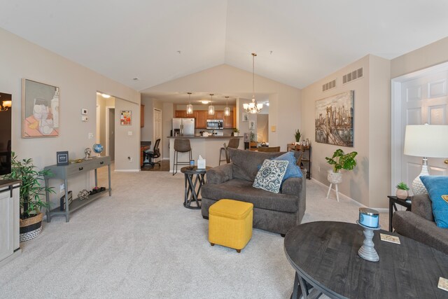 living area featuring a notable chandelier, light colored carpet, and visible vents