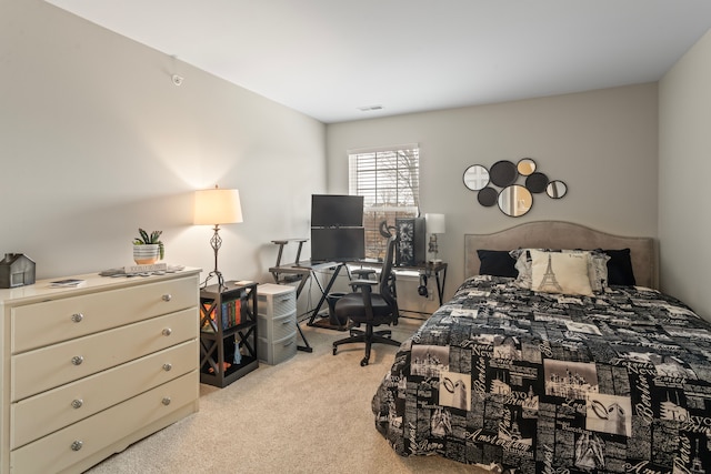 bedroom with visible vents and carpet floors