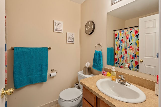 full bathroom with vanity, a shower with shower curtain, and toilet