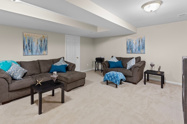 carpeted living area with baseboards and visible vents