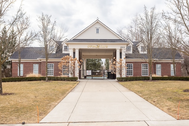 view of building exterior featuring concrete driveway