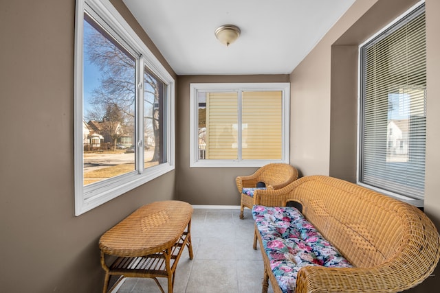 sitting room with tile patterned flooring and baseboards