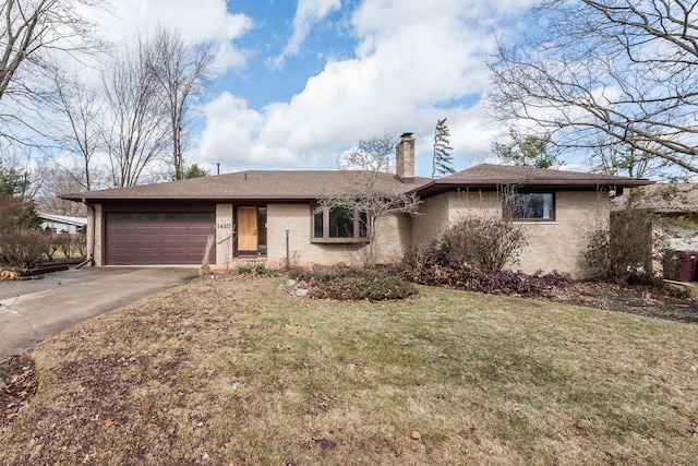 ranch-style home featuring driveway, a front yard, a garage, brick siding, and a chimney