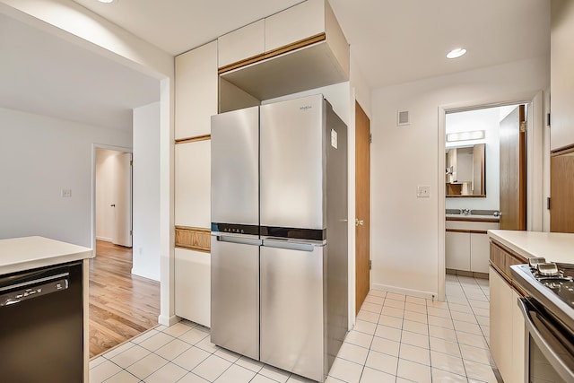 kitchen with visible vents, recessed lighting, appliances with stainless steel finishes, light countertops, and light tile patterned floors