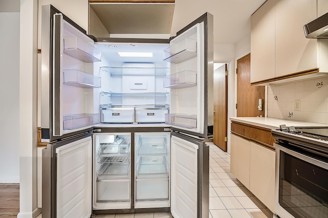 kitchen featuring decorative backsplash, range hood, range, and open shelves