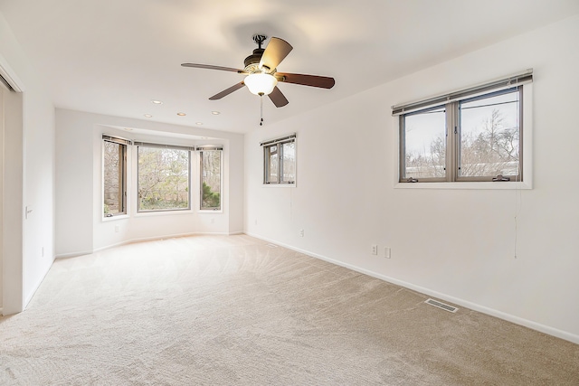 unfurnished room with recessed lighting, baseboards, carpet, and a ceiling fan