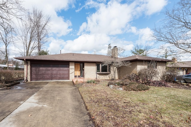 ranch-style home featuring a front lawn, driveway, roof with shingles, a garage, and a chimney