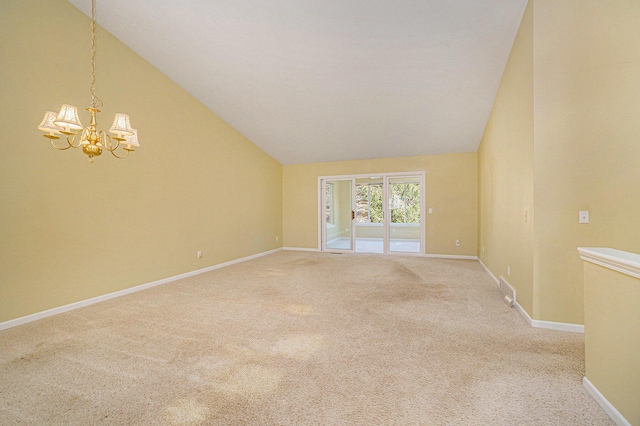 empty room with vaulted ceiling, baseboards, carpet floors, and a chandelier