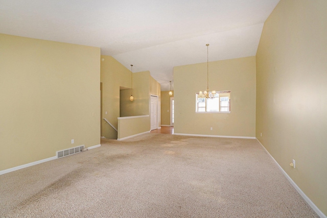 unfurnished room with visible vents, light carpet, a notable chandelier, high vaulted ceiling, and baseboards