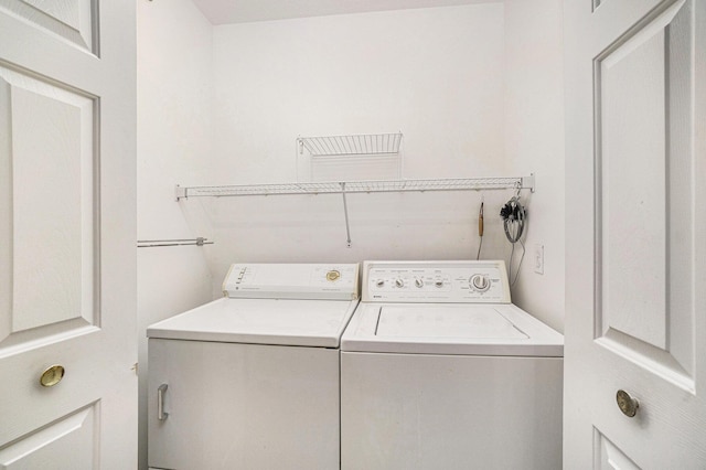 laundry area featuring independent washer and dryer and laundry area