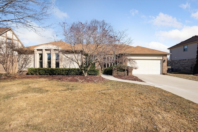 single story home with brick siding, a garage, driveway, and a front yard