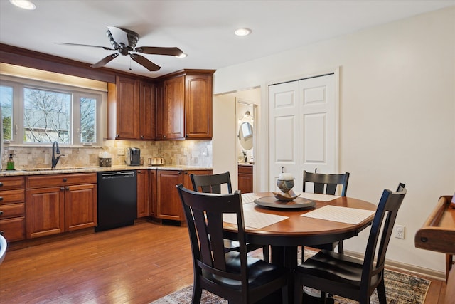 dining room featuring recessed lighting, baseboards, a ceiling fan, and hardwood / wood-style flooring