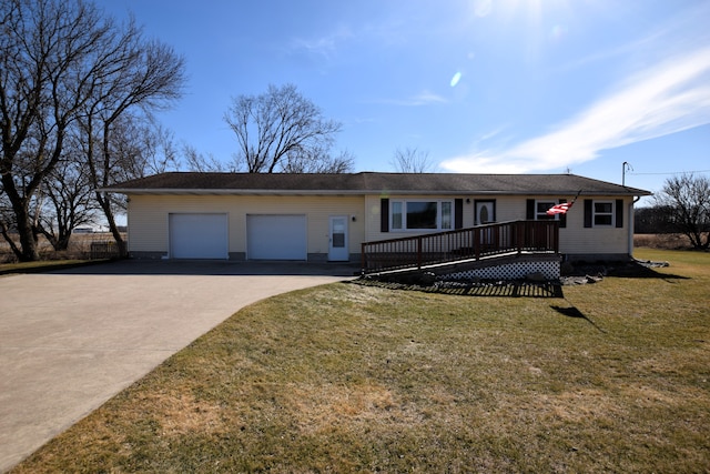 ranch-style home with a deck, a front lawn, an attached garage, and driveway