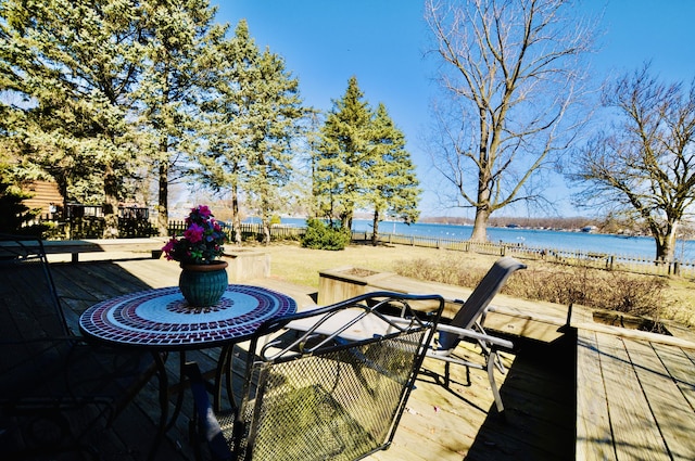 view of patio with a deck with water view